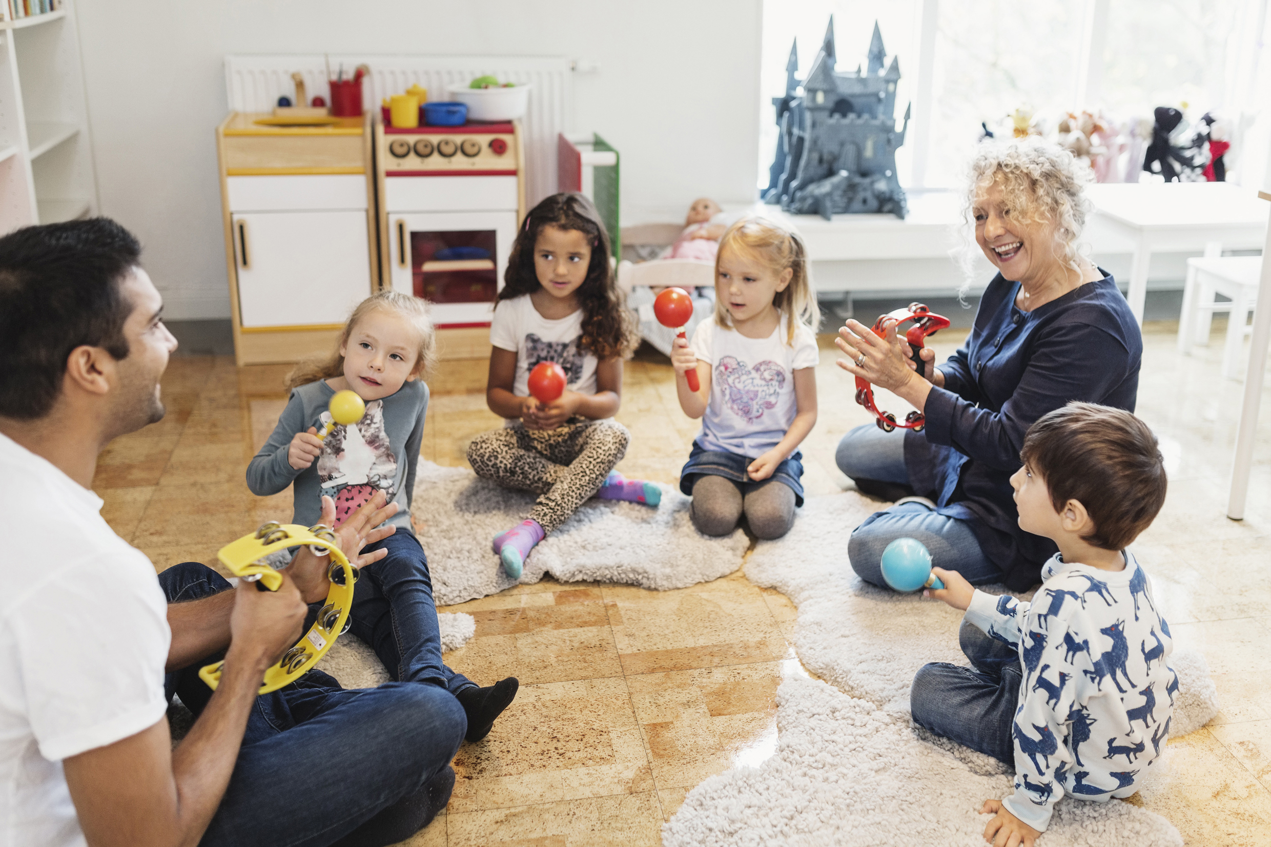 Young children and teacher being observed in class